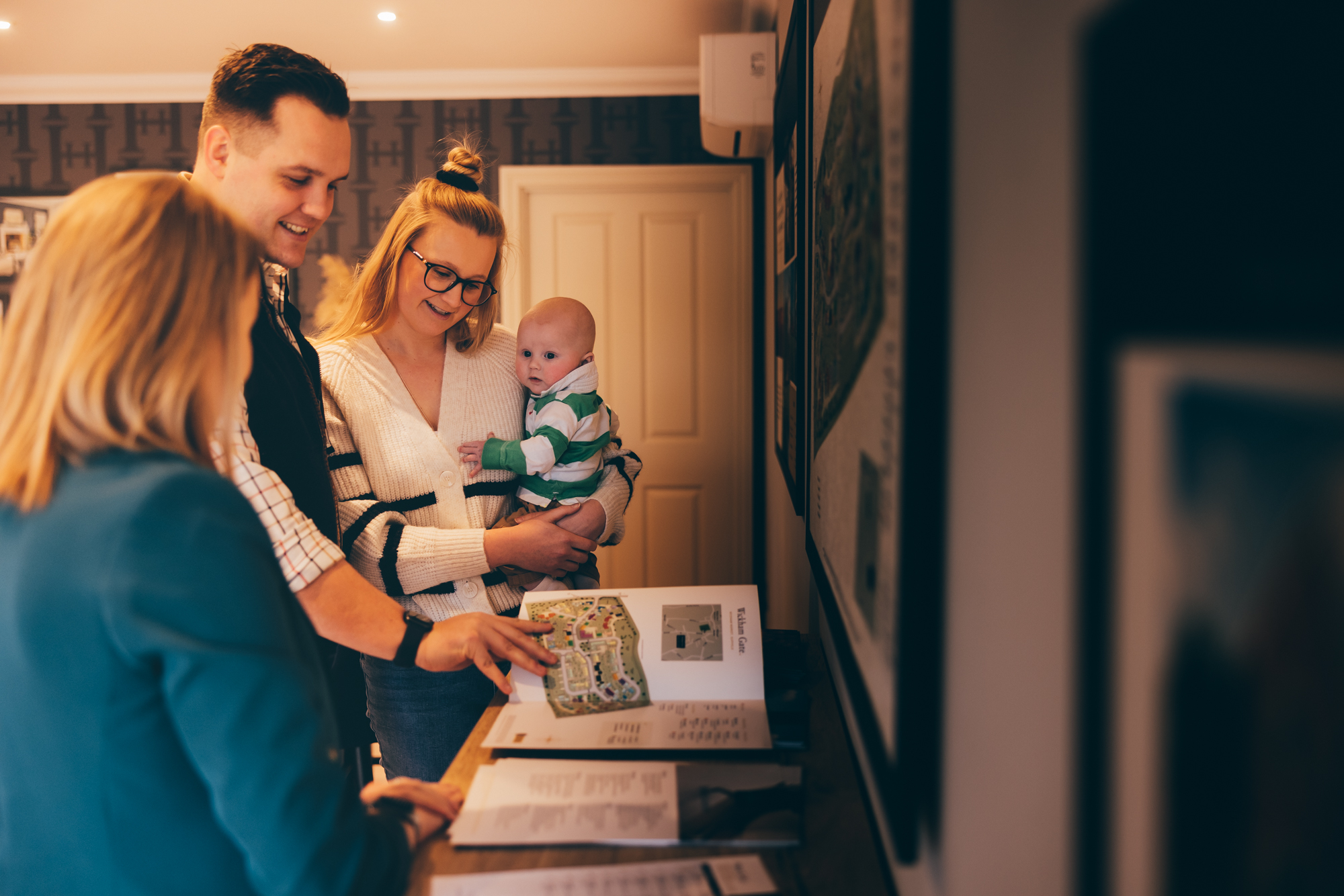 A young family in choosing their home at a Hopkins Homes development