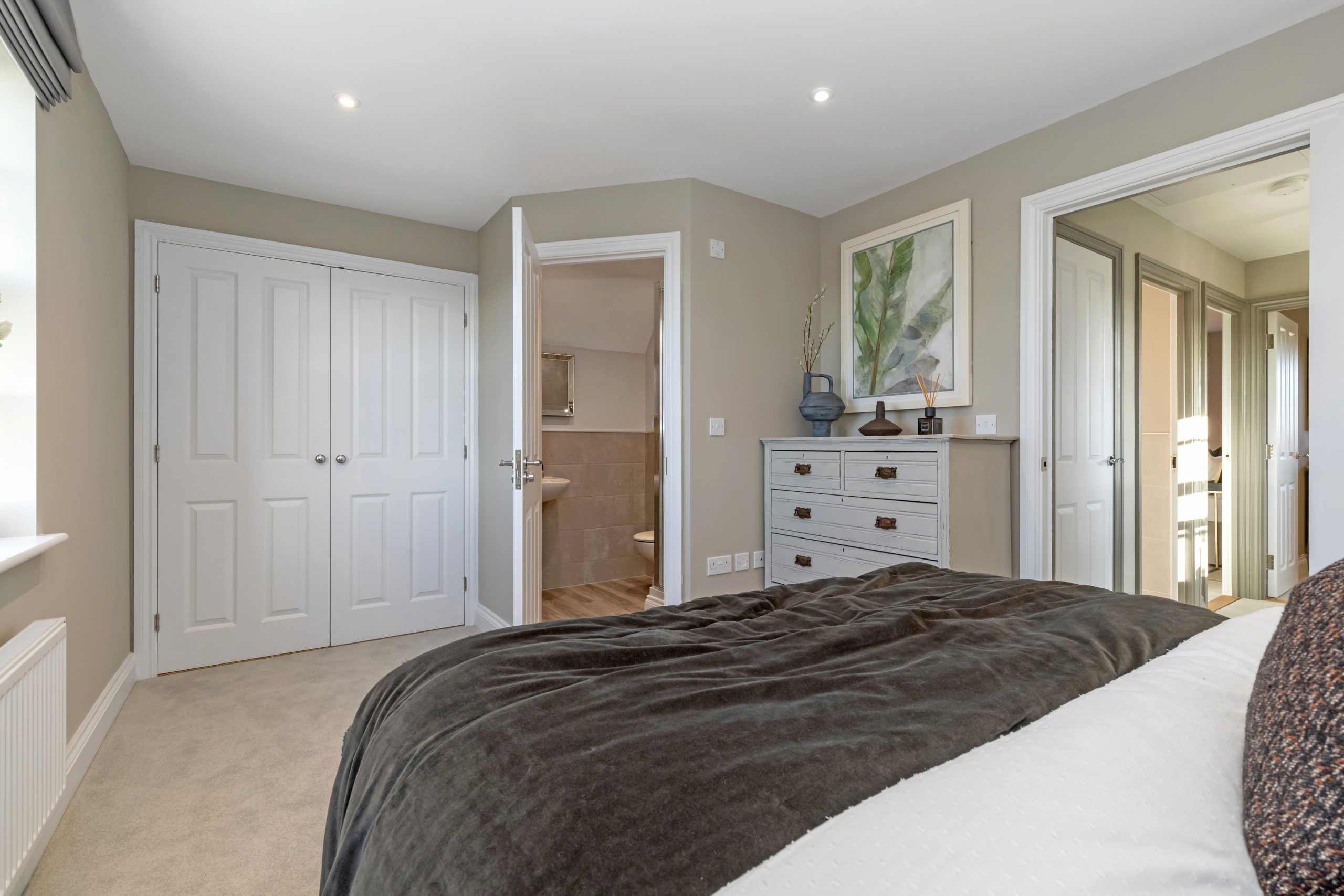 Built-in double wardrobes in a bedroom at a Hopkins Homes new build property