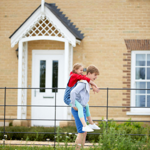 Brother and sister in front of a Hopkins home