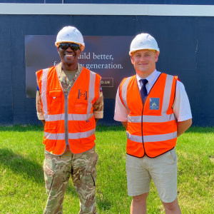 Two men in hi vis and hard hats