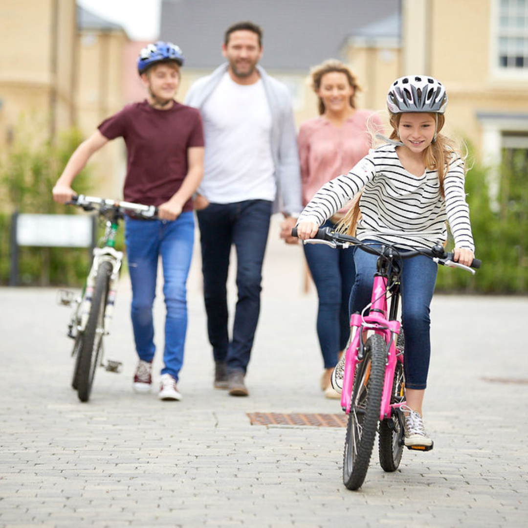 A family with children riding their bikes